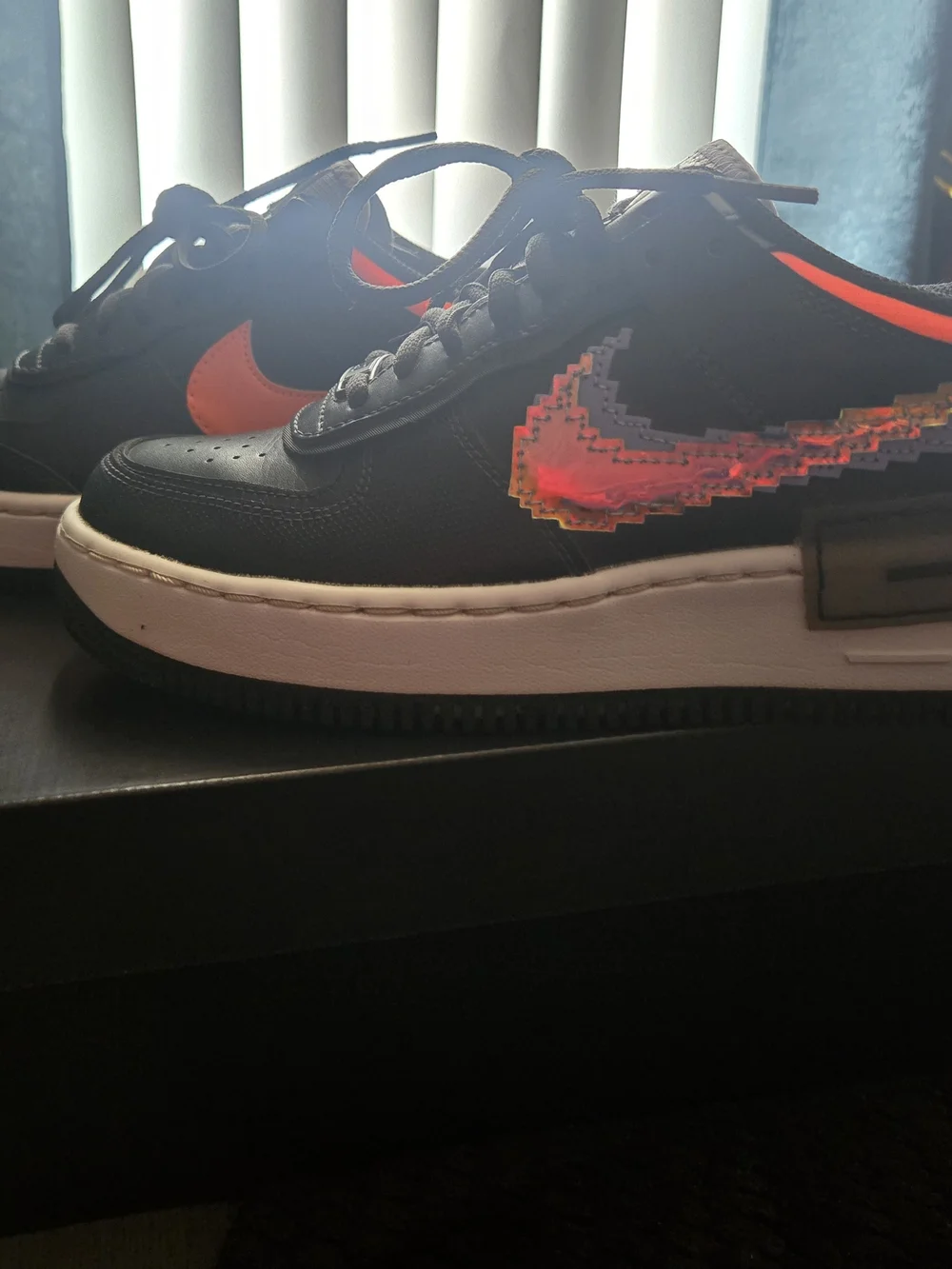 Nike Women’s Black Sneakers with Neon Orange Pixel Swoosh